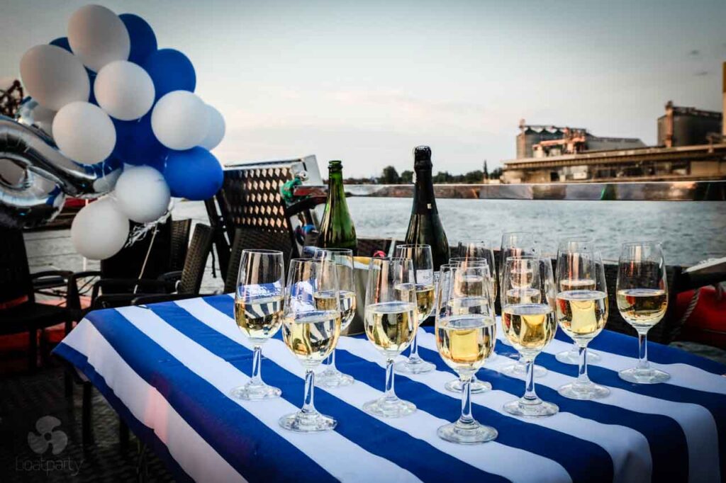 Champagne glasses and balloons at a boat party
