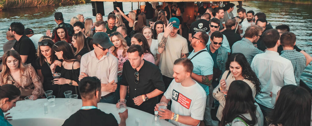 Large group of guests at a boat party
